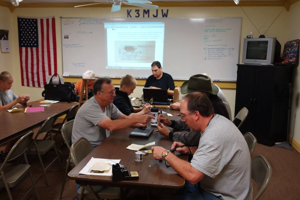 Some of the members of Skyview Radio Society soldering their HumanaLight projects during Skyview Radio Society’s “Solder Smoke Elmer Night.” (Photo Credit: Bob Bereit, K3RMB)