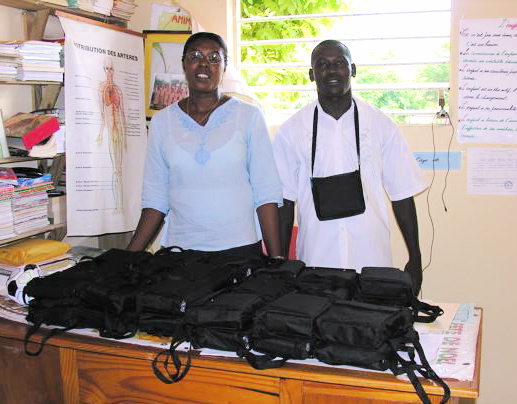 4 Teachers at the Petite-Rivière school prepare to distrubute ETOW radios to all of their teachers. Radios shown in their protective carry cases.